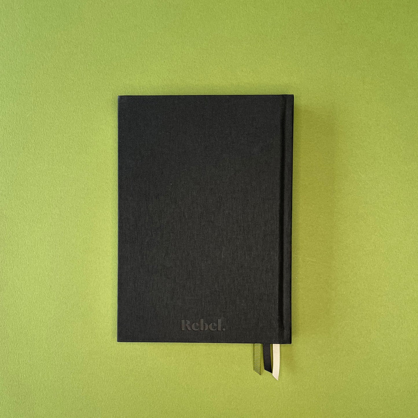 Back cover of Rebel Stationery's Signature diary in Ink on green background