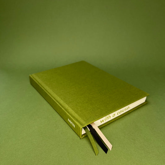 Rebel Stationery's Signature notebook in Moss on green background