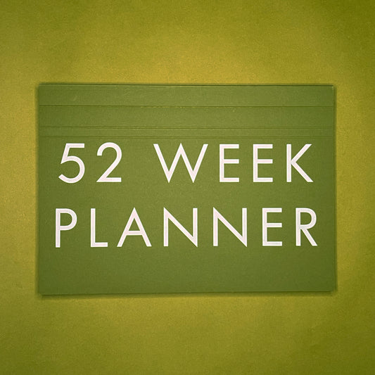 Front cover of Rebel Stationery's A4 Weekly Desk Planner in Moss on green background