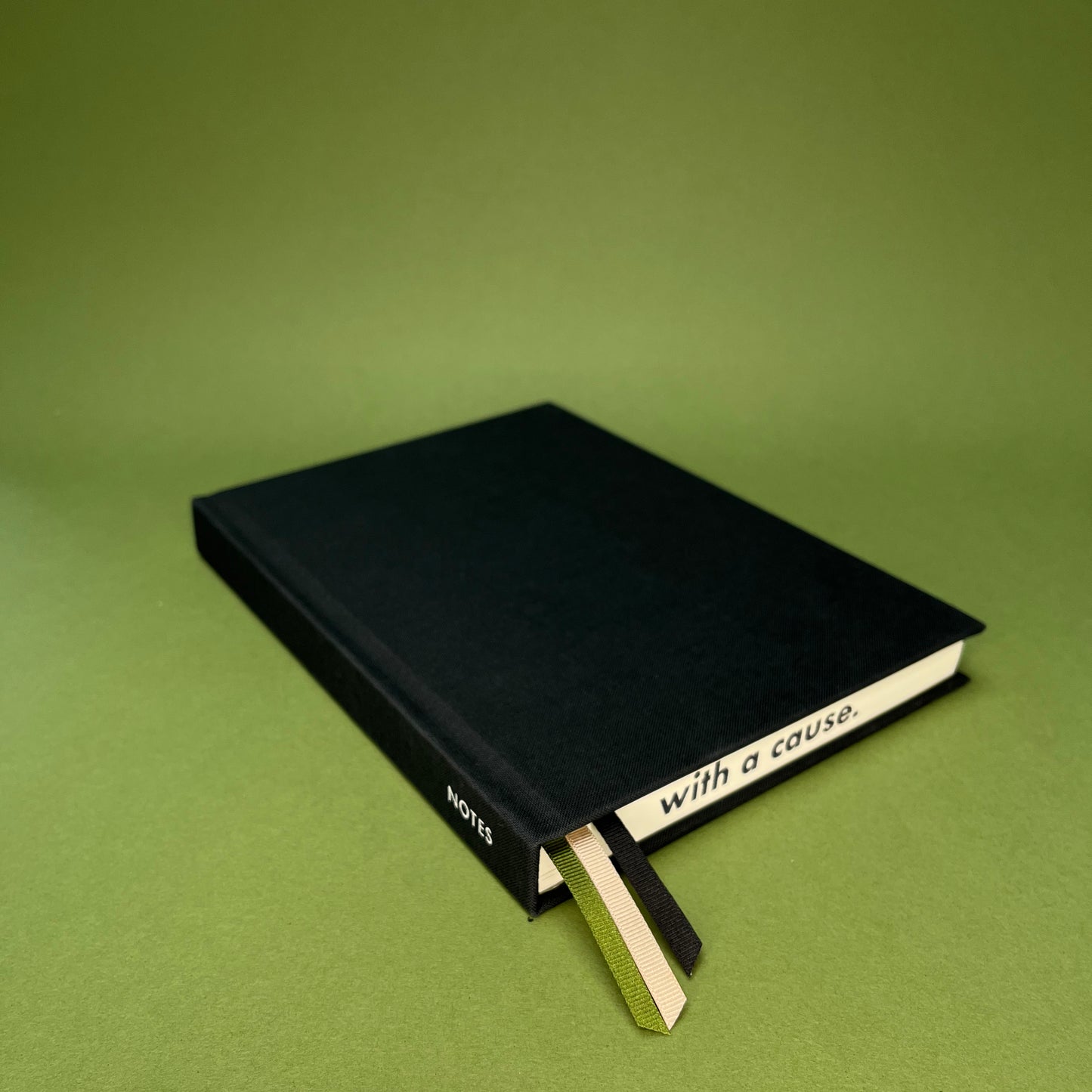 Rebel Stationery's Signature notebook in Ink on green background