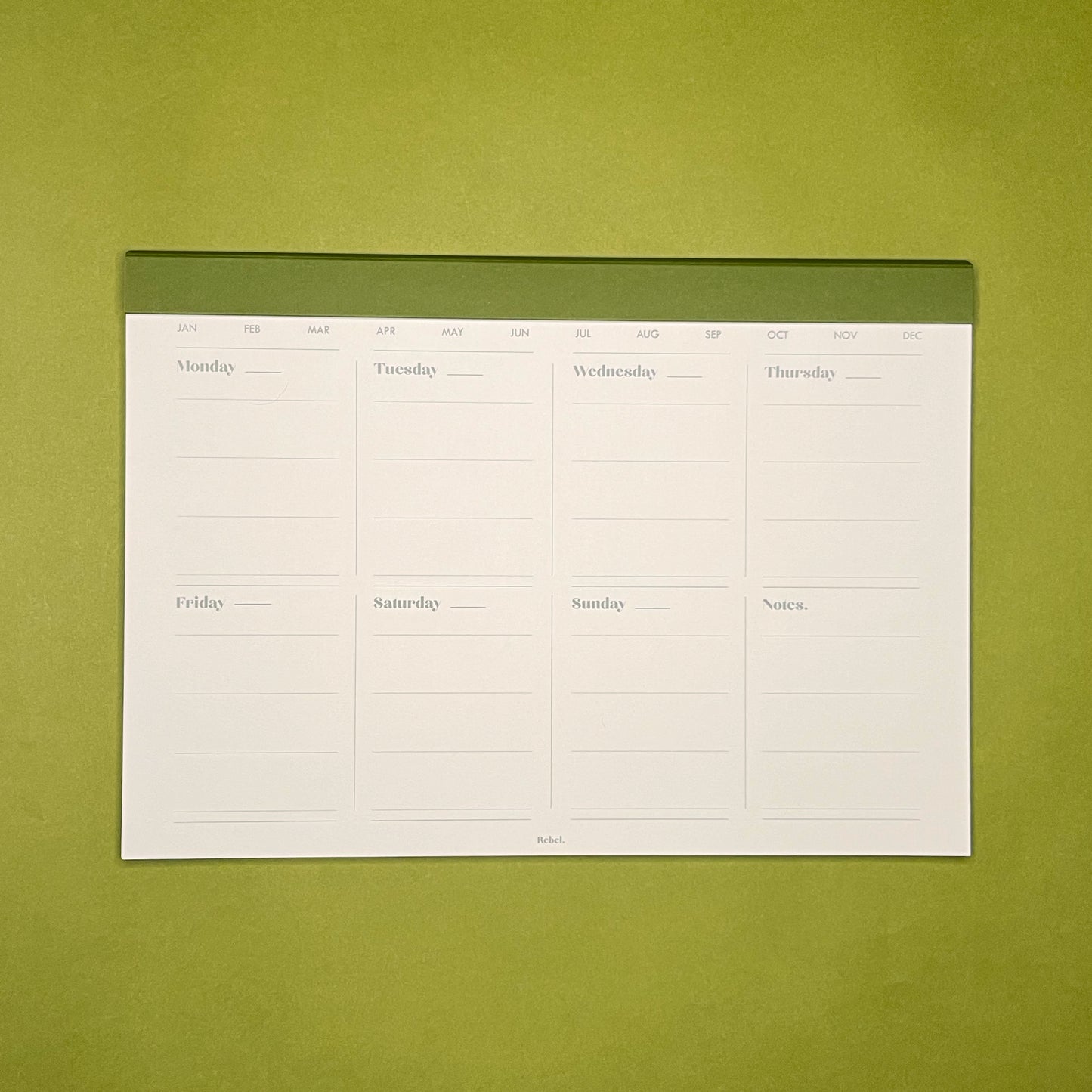 Inside spread of Rebel Stationery's 52 Week Planner in Moss on green background