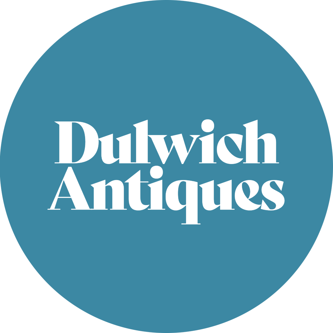 Dulwich Antiques logo with white text on a blue circle background