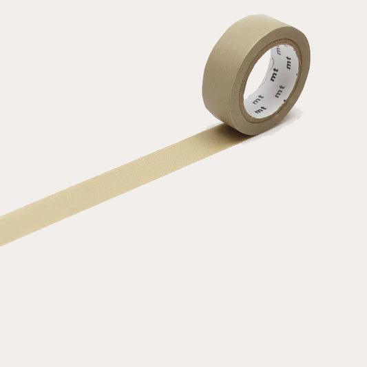 Beige masking tape with a white label on a light grey background