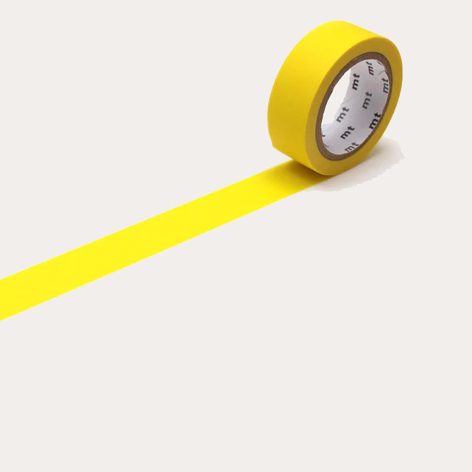 Yellow tape with a white label on a light grey background