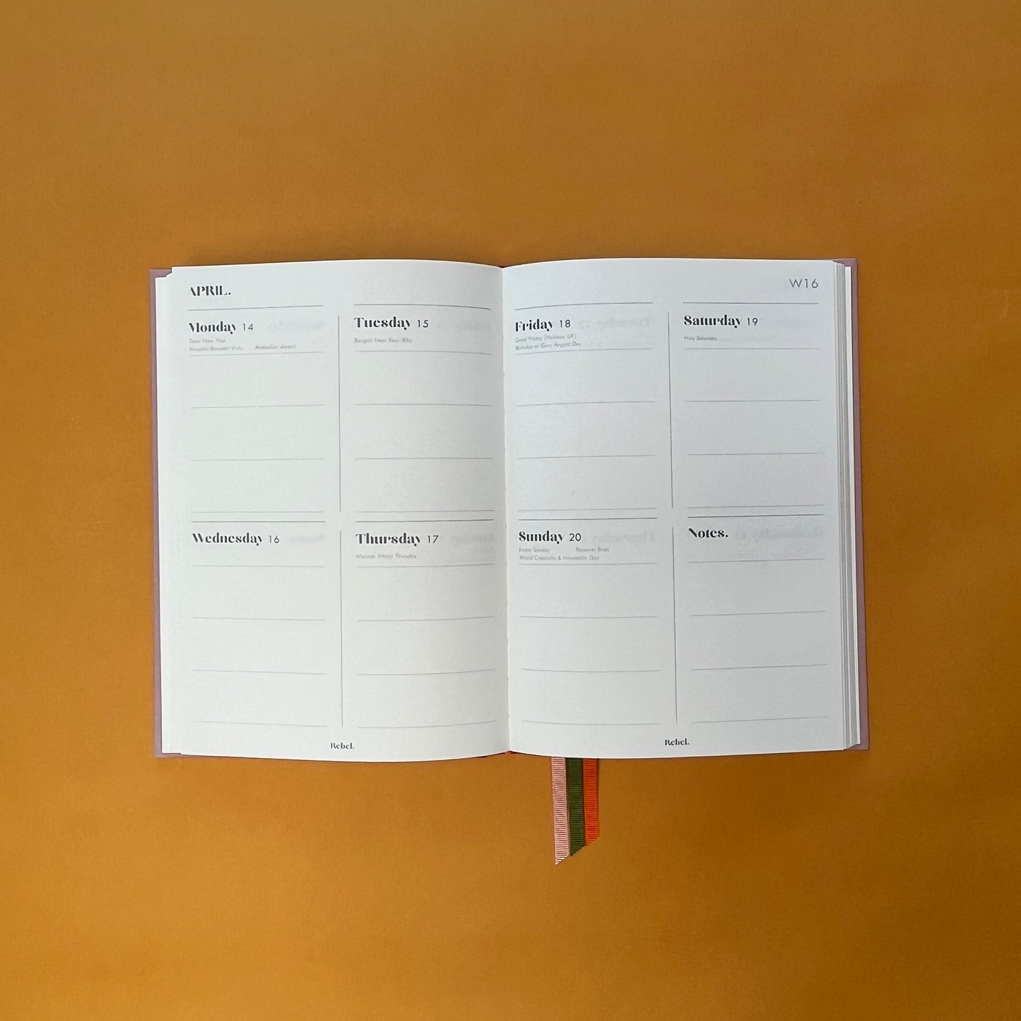 WTV spread of Rebel Stationery's Seasonal Rose notebook, a pink A5 with orange-red linen spine, on a yellow background